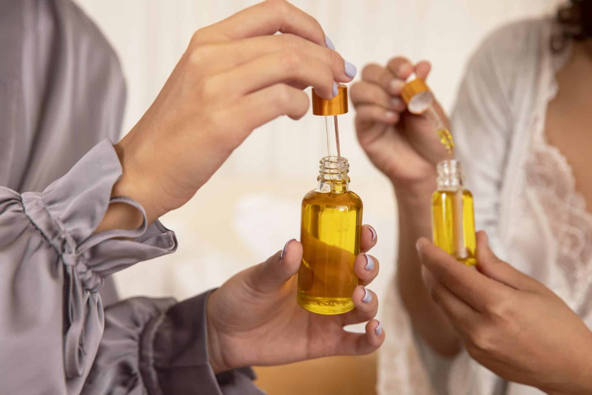 hands-holding-serum-containers-close-up